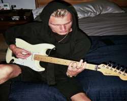 He started playing guitar at the very young age of seven.
